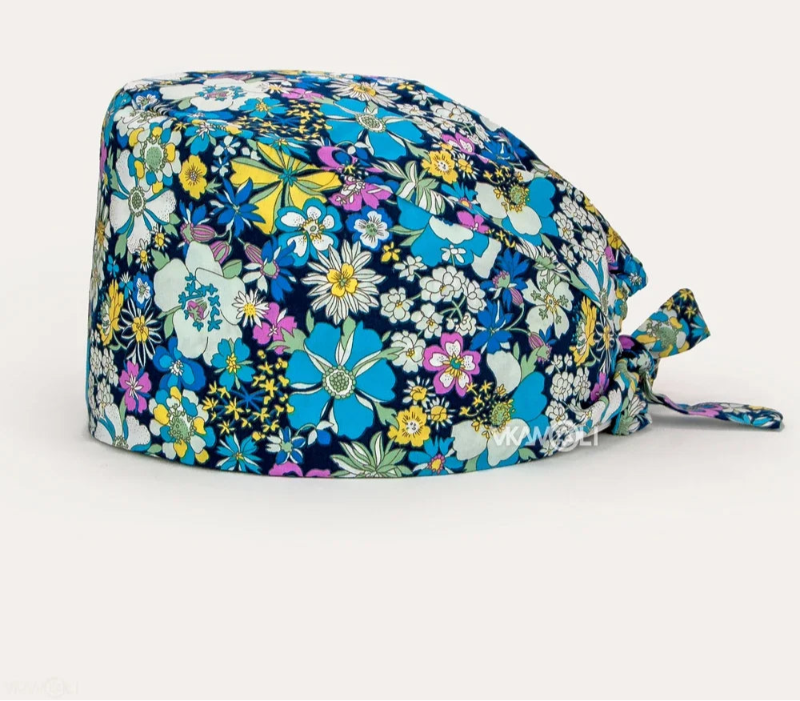Check out these the Flower-Printed OR Caps! You know, because nothing says 'I'm a professional' like wearing a cap that looks like a garden party exploded on your head - Healthcare Vibes