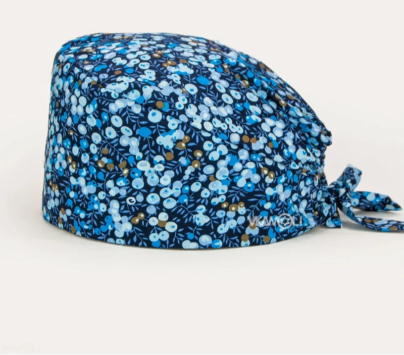 Check out these the Flower-Printed OR Caps! You know, because nothing says 'I'm a professional' like wearing a cap that looks like a garden party exploded on your head - Healthcare Vibes