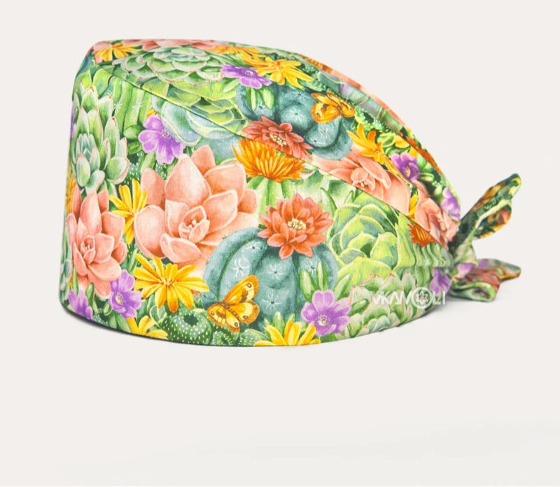 Check out these the Flower-Printed OR Caps! You know, because nothing says 'I'm a professional' like wearing a cap that looks like a garden party exploded on your head - Healthcare Vibes