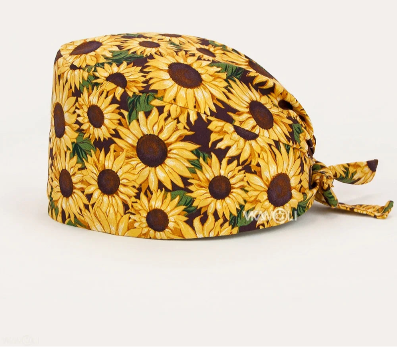 Check out these the Flower-Printed OR Caps! You know, because nothing says 'I'm a professional' like wearing a cap that looks like a garden party exploded on your head - Healthcare Vibes