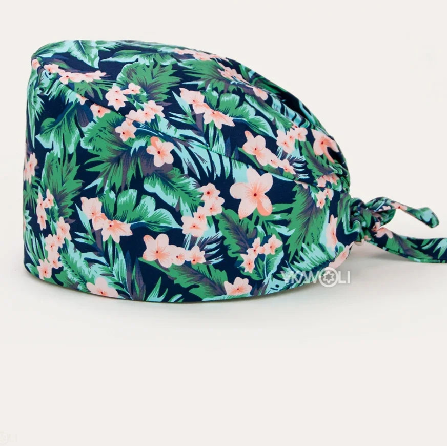 Check out these the Flower-Printed OR Caps! You know, because nothing says 'I'm a professional' like wearing a cap that looks like a garden party exploded on your head - Healthcare Vibes