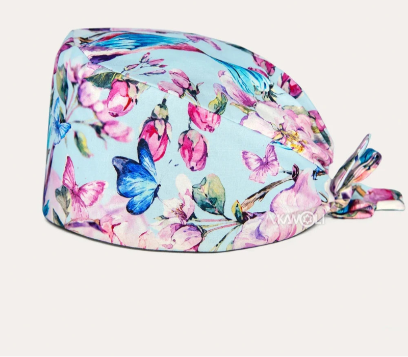 Check out these the Flower-Printed OR Caps! You know, because nothing says 'I'm a professional' like wearing a cap that looks like a garden party exploded on your head - Healthcare Vibes