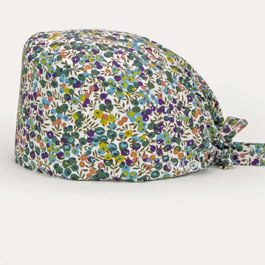 Check out these the Flower-Printed OR Caps! You know, because nothing says 'I'm a professional' like wearing a cap that looks like a garden party exploded on your head - Healthcare Vibes