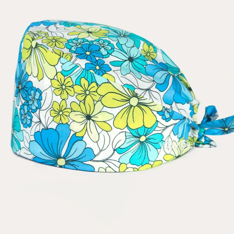 Check out these the Flower-Printed OR Caps! You know, because nothing says 'I'm a professional' like wearing a cap that looks like a garden party exploded on your head - Healthcare Vibes