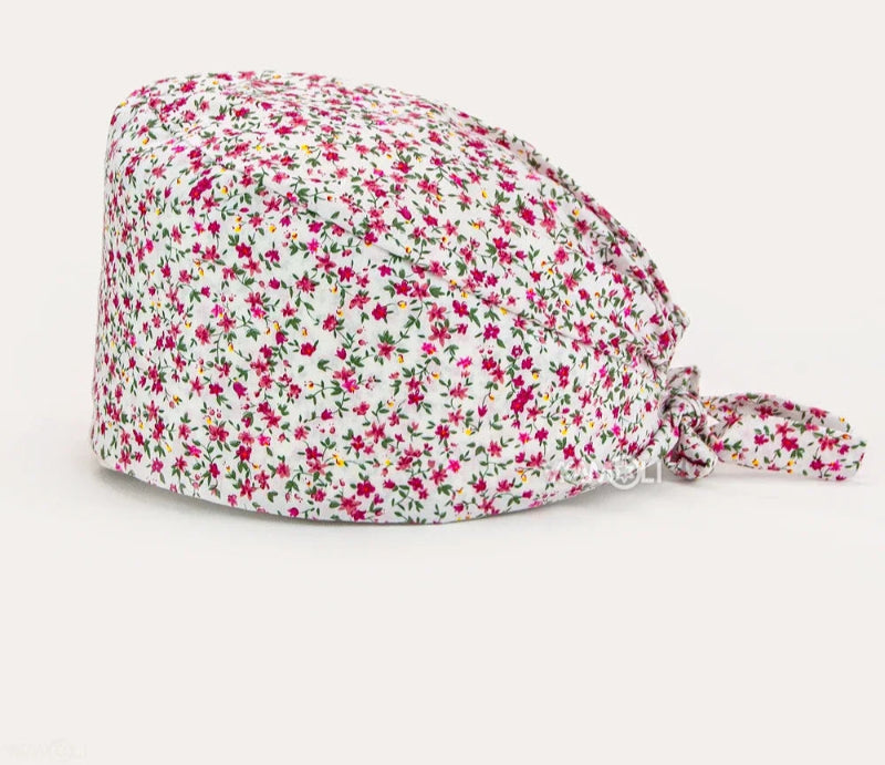Check out these the Flower-Printed OR Caps! You know, because nothing says 'I'm a professional' like wearing a cap that looks like a garden party exploded on your head - Healthcare Vibes