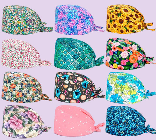Check out these the Flower-Printed OR Caps! You know, because nothing says 'I'm a professional' like wearing a cap that looks like a garden party exploded on your head - Healthcare Vibes